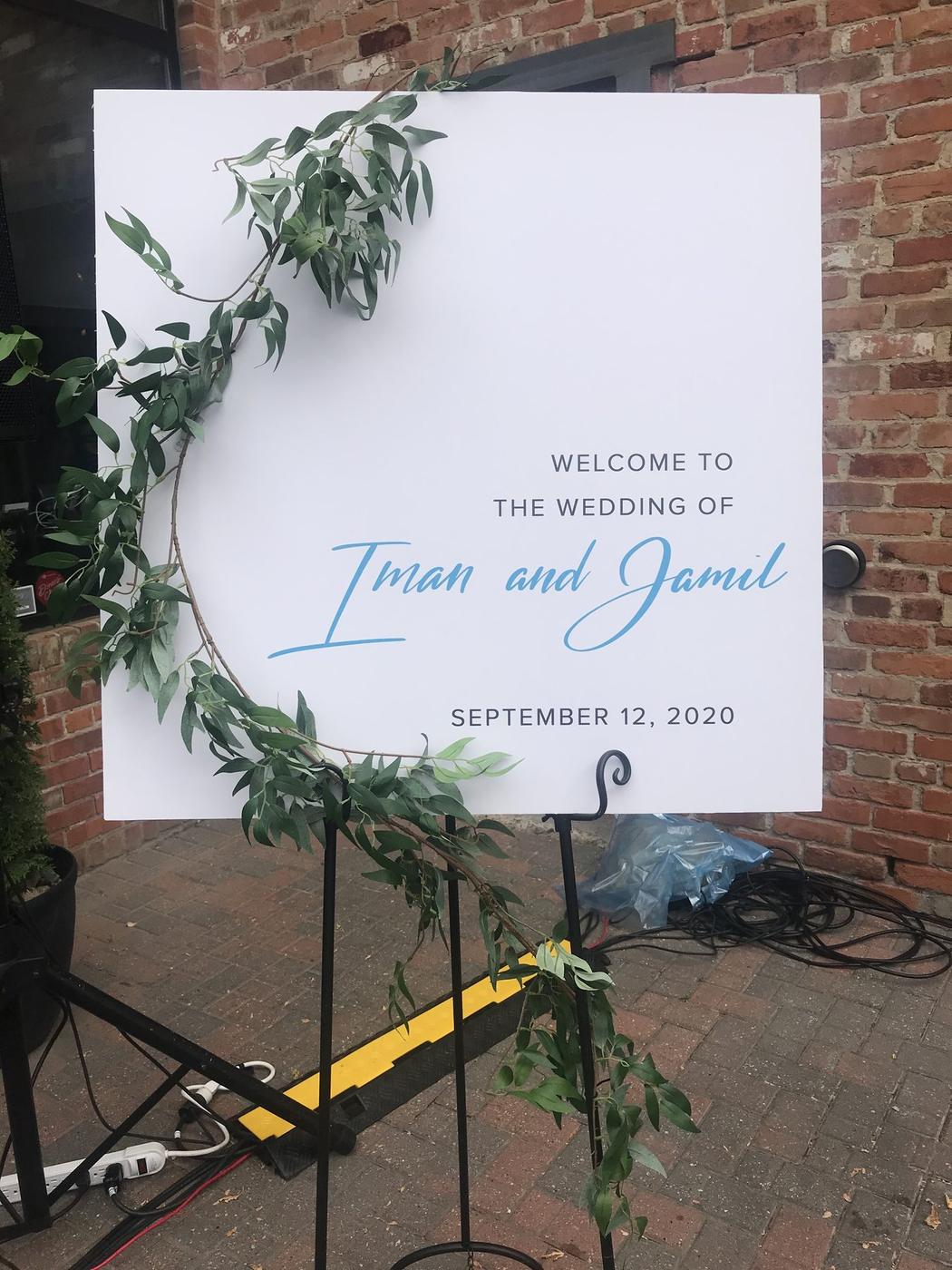 Welcome sign for a wedding with flowing script lettering